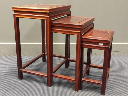 Lot 547 - A Chinese nest of three rosewood tables, 60 x...