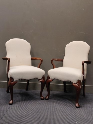 Lot 525 - A pair of mahogany open arm chairs, in George...