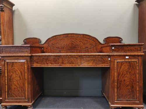 Lot 620 - An early 19th century flame mahogany twin...