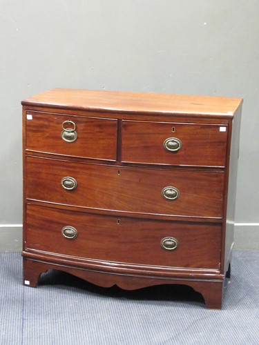 Lot 519 - A 19th century bow fronted chest of drawers,...