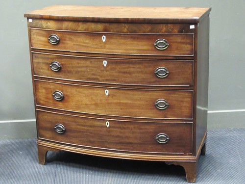 Lot 524 - A George III bow fronted chest of drawers with...