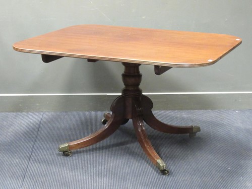 Lot 621 - A Regency mahogany tilt top table with down...