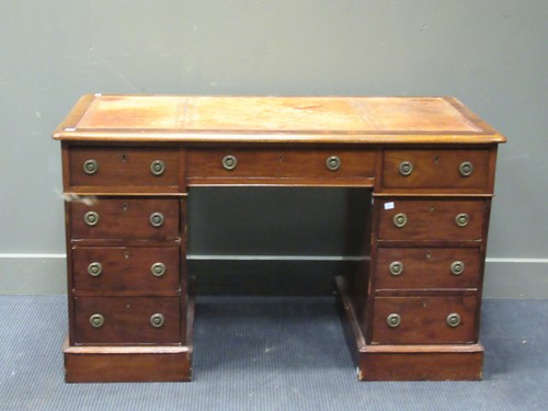 Lot 586 - A mahogany pedestal desk with brown leather...