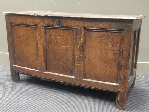 Lot 593 - An 18th century oak three panelled coffer, 67...