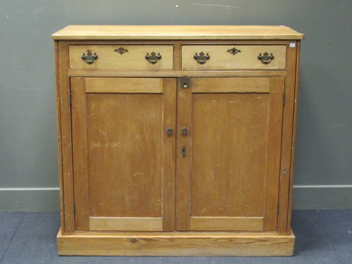 Lot 536 - An early 20th century pine two drawer cupboard...