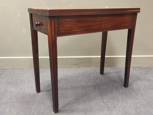 Lot 545 - An early 19th century mahogany tea table, the...