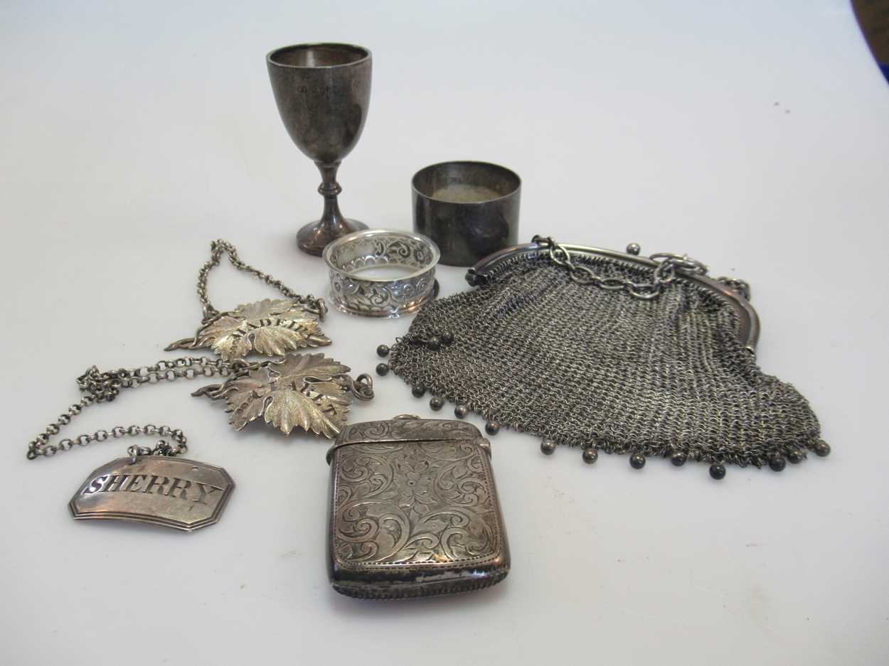 Lot 266 - A silver chain maille coin purse, three silver...