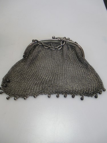 Lot 266 - A silver chain maille coin purse, three silver...