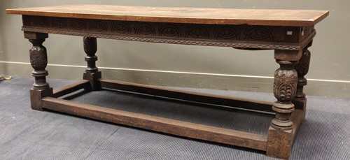 Lot 613 - A 17th style oak refectory table on cup and...
