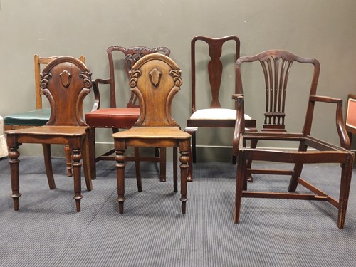 Lot 564 - A Georgian style elbow chair with red faux...