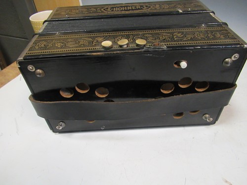 Lot 63 - Two vintage squeeze boxes, one by Hohner, the...