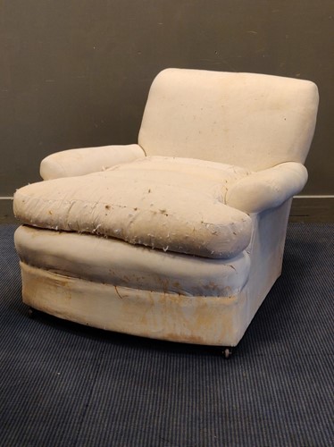 Lot 571 - A large low armchair, cover missing