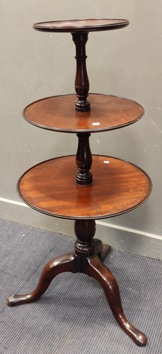 Lot 561 - A Georgian mahogany three tier dumb waiter 123...