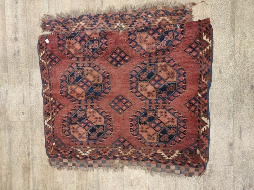 Lot 697 - A small red ground tekke, 101 x 100cm,...