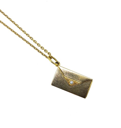 Lot 78 - Cartier - An envelope pendant and chain