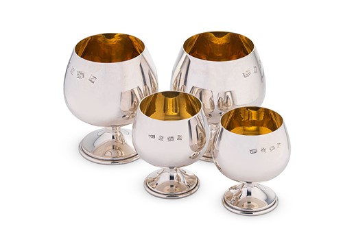 Lot 675 - Two pairs of mid 20th century silver brandy snifters