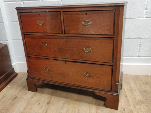 Lot 509 - A walnut chest of two short over two long...