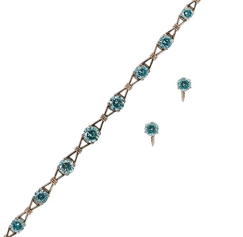 Lot 141 - A zircon bracelet and a pair of ear studs