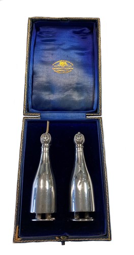 Lot 449 - A cased pair of early 20th century silver novelty table cigar lighters