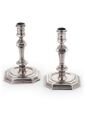 Lot 680 - A pair of mid 20th century cast silver candlesticks