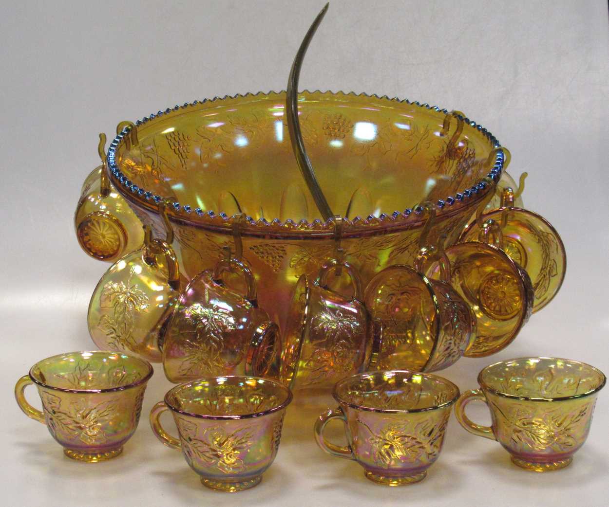 Lot 211 - An iridescent carnival glass punch bowl and...