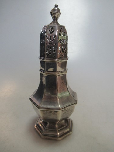 Lot 259 - An octagonal silver baluster caster, 1934, 6ozs