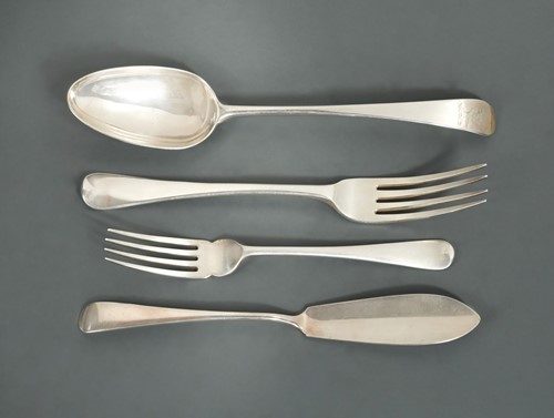 Lot 556 - A 32-piece harlequin set of George III and later silver cutlery and flatware
