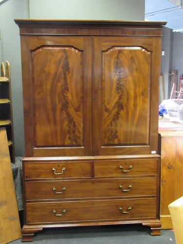 Lot 641 - A George III mahogany linen press, the moulded...