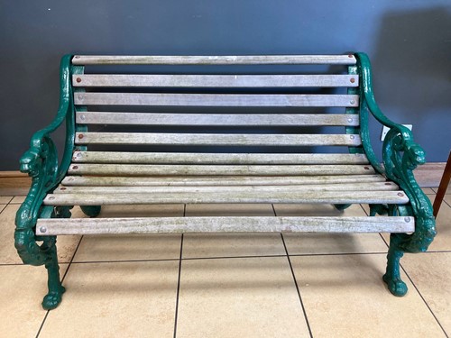 Lot 665 - A Victorian style garden bench, the green...