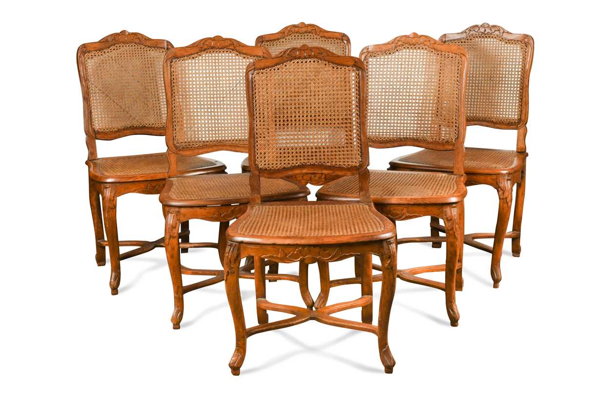 Lot 580 - A set of six Louis XV caned side chairs