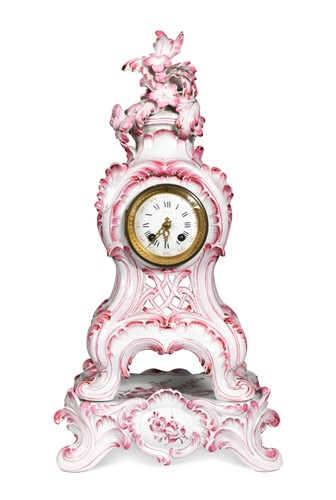 Lot 585 - A French porcelain Rococo style mantel clock on stand, late 19th century