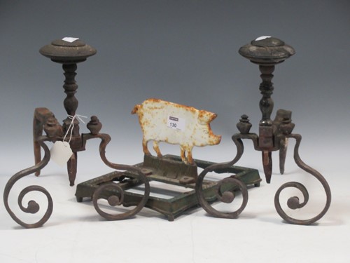 Lot 130 - A pair of wrought iron andirons and a pig...
