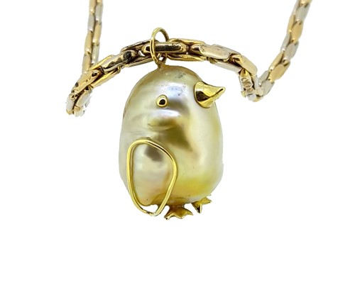 Lot 47 - An Indonesian cultured baroque pearl pendant and chain