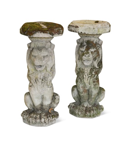 Lot 418 - A pair of composite stone seated garden lions, 20th century