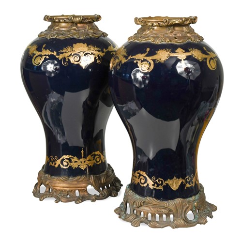 Lot 358 - A large pair of gilt metal mounted Continental porcelain vases