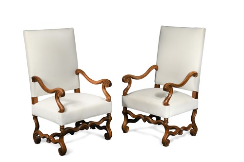 Lot 500 - A pair of French Louis XIV style walnut open arm chairs