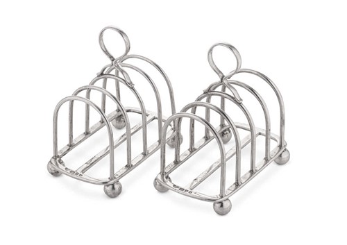 Lot 665 - A pair of Edward VIII silver 5 bar toast racks