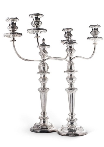 Lot 555 - A pair of George III silver candlesticks with later silver plated branches