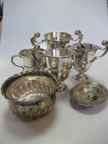 Lot 217 - A collection of silverware including 4 trophy...