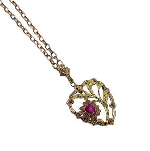 Lot 107 - A ruby heart pendant and chain