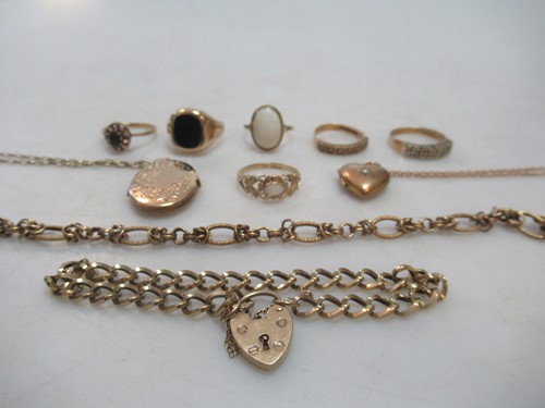 Lot 229 - an oval locket and chain, a heart locket and...