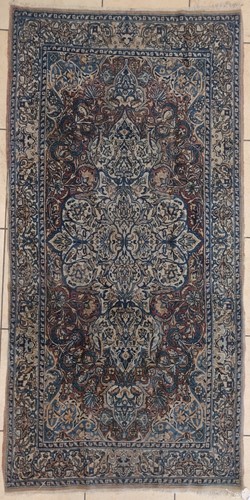 Lot 614 - A Kerman rug, 218 x 121cm