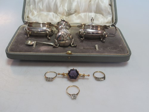 Lot 239 - a hallmarked 9ct gold three stone diamond ring,...