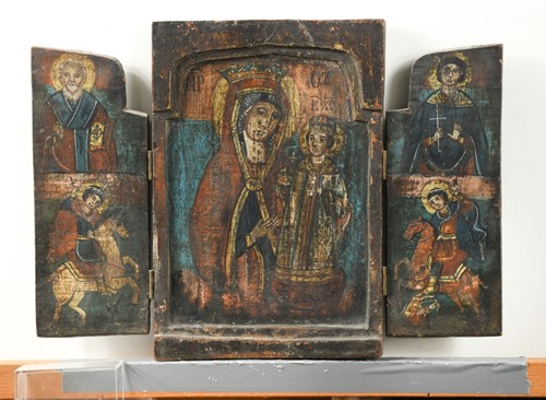 Lot 96 - A folding icon with Cyrillic script, 30cm high