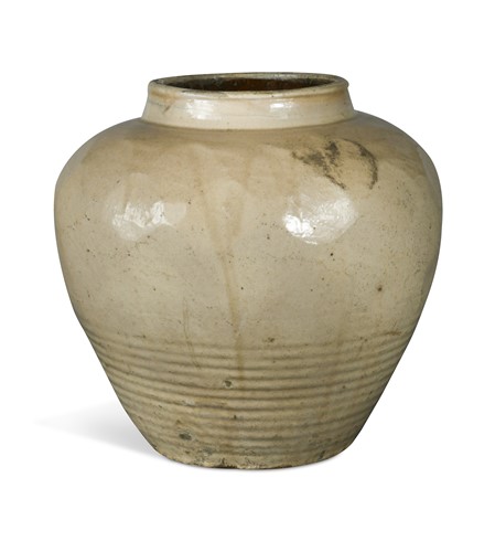 Lot 85 - A large Oriental cream-glazed pottery storage jar, possibly Korean, 19th century