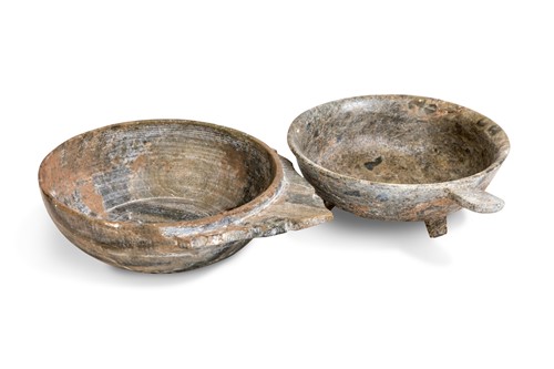 Lot 92 - A Chinese turned and carved greenstone tab handled cup, perhaps Han Dynasty