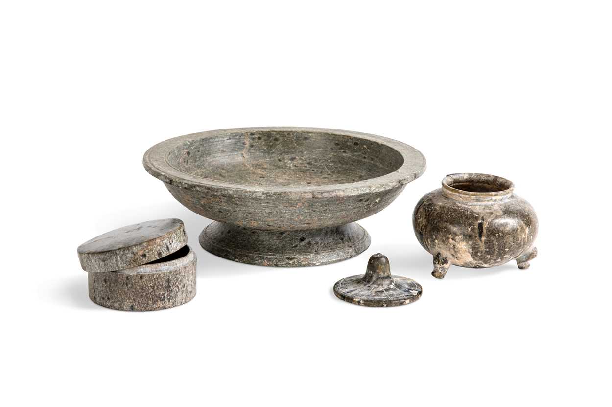 Lot 91 - A Chinese green puddingstone tripod small vase, perhaps Tang Dynasty