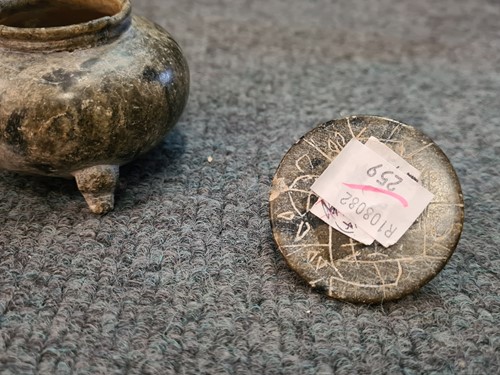 Lot 91 - A Chinese green puddingstone tripod small vase, perhaps Tang Dynasty
