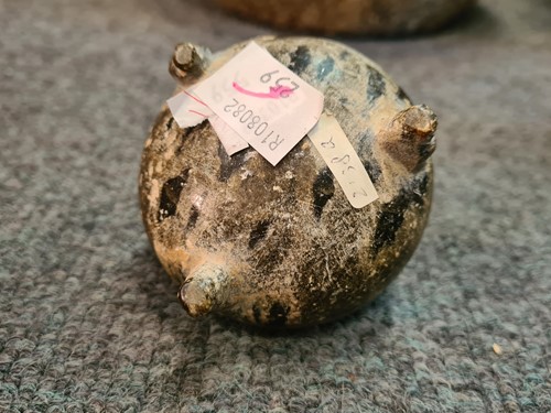 Lot 91 - A Chinese green puddingstone tripod small vase, perhaps Tang Dynasty