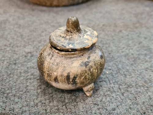 Lot 91 - A Chinese green puddingstone tripod small vase, perhaps Tang Dynasty